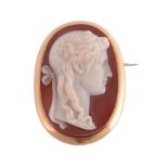 A hardstone cameo brooch, the oval hardstone cameo carved with a lady's profile, within a polished