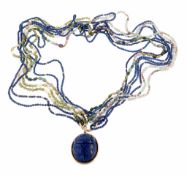 A multi gem necklace with a scarab beetle pendant, the various bead necklaces including tourmaline,
