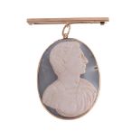 A mid 19th century hardstone cameo pendant, circa 1860, carved with the profile of a man wearing