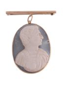 A mid 19th century hardstone cameo pendant, circa 1860, carved with the profile of a man wearing
