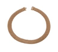 A collar necklace, composed of polished mesh links, to a concealed snap clasp, stamped 750 with