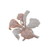 A diamond set orchid brooch, the pave set brilliant cut diamond petals and stamen in a two colour