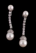 A pair of cultured pearl and diamond earrings, the 9mm cultured pearl drops with an eight cut
