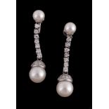 A pair of cultured pearl and diamond earrings, the 9mm cultured pearl drops with an eight cut