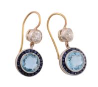 A pair of aquamarine, diamond and sapphire earrings, the central circular shaped aquamarine in a
