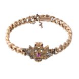 A Russian bangle, the central panel pierced with an imperial double eagle with rose cut diamond