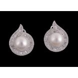 A pair of South Sea cultured pearl and diamond earrings, centrally set with a 10.4mm South Sea