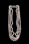 A three strand cultured pearl and diamond necklace, composed of three graduated strands of uniform