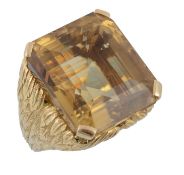 A citrine dress ring mounted by Cartier, circa 1960, the step cut citrine with canted corners, claw