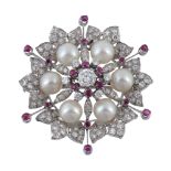 A diamond ruby and cultured pearl flower head brooch, the diamond and ruby cluster centre to