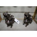 A pair of Oriental bronze dragon locks, 14cm long approx.