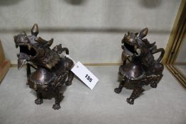 A pair of Oriental bronze dragon locks, 14cm long approx.