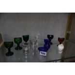 A collection of assorted glass eye baths and one ceramic bath -11