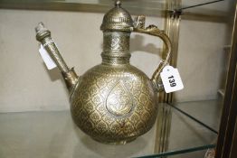 An Islamic engraved ewer (AF)