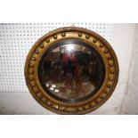 A Regency giltwood convex wall mirror (damage) 64cm diameter