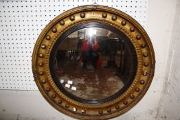 A Regency giltwood convex wall mirror (damage) 64cm diameter