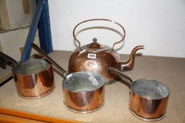 Four items of copper, to include a kettle and three pan-shaped measures. Best Bid