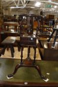 A George III mahogany tripod shaving stand 80cm high