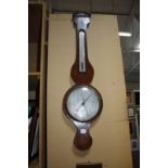 A 19th Century mahogany inlaid wheel barometer, the silvered dial marked Gilardone & Co. Exeter
