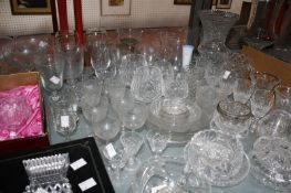 A quantity of domestic drinking glasses, to include Edinburgh Crystal, together with cut glass vases