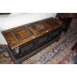 A Victorian carved triple panel chest 138cm wide