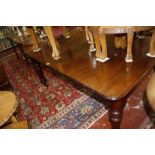 A Victorian mahogany dining table