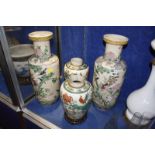 A pair of Chinese famille verte crackle glaze vases, 24cm high (one cracked), on wooden stands and