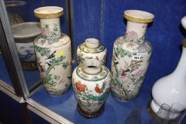 A pair of Chinese famille verte crackle glaze vases, 24cm high (one cracked), on wooden stands and