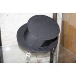 A collapsible black silk top hat, Woodrow of Piccadilly by appointment of his Majesty 'The King'