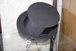 A collapsible black silk top hat, Woodrow of Piccadilly by appointment of his Majesty 'The King'