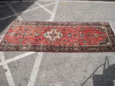 A Persian Hamadan runner, 275cm x 130cm.