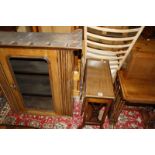 An Edwardian mahogany sutherland table, nest of three tables and an oak glazed hanging cupboard