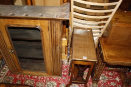 An Edwardian mahogany sutherland table, nest of three tables and an oak glazed hanging cupboard