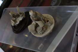 Two Japanese ivory figures, one depicting man sat with fan, bowl and brush pot (AF), marked to base,