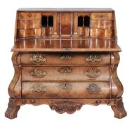 A Dutch walnut bureau, late 18th century, the rectangular fall opening to an...  A Dutch walnut