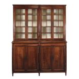 A French solid walnut and glazed display cabinet, first half 19th century  A French solid walnut and