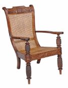 A Colonial hardwood planter's armchair, possibly West Indies  A Colonial hardwood planter's