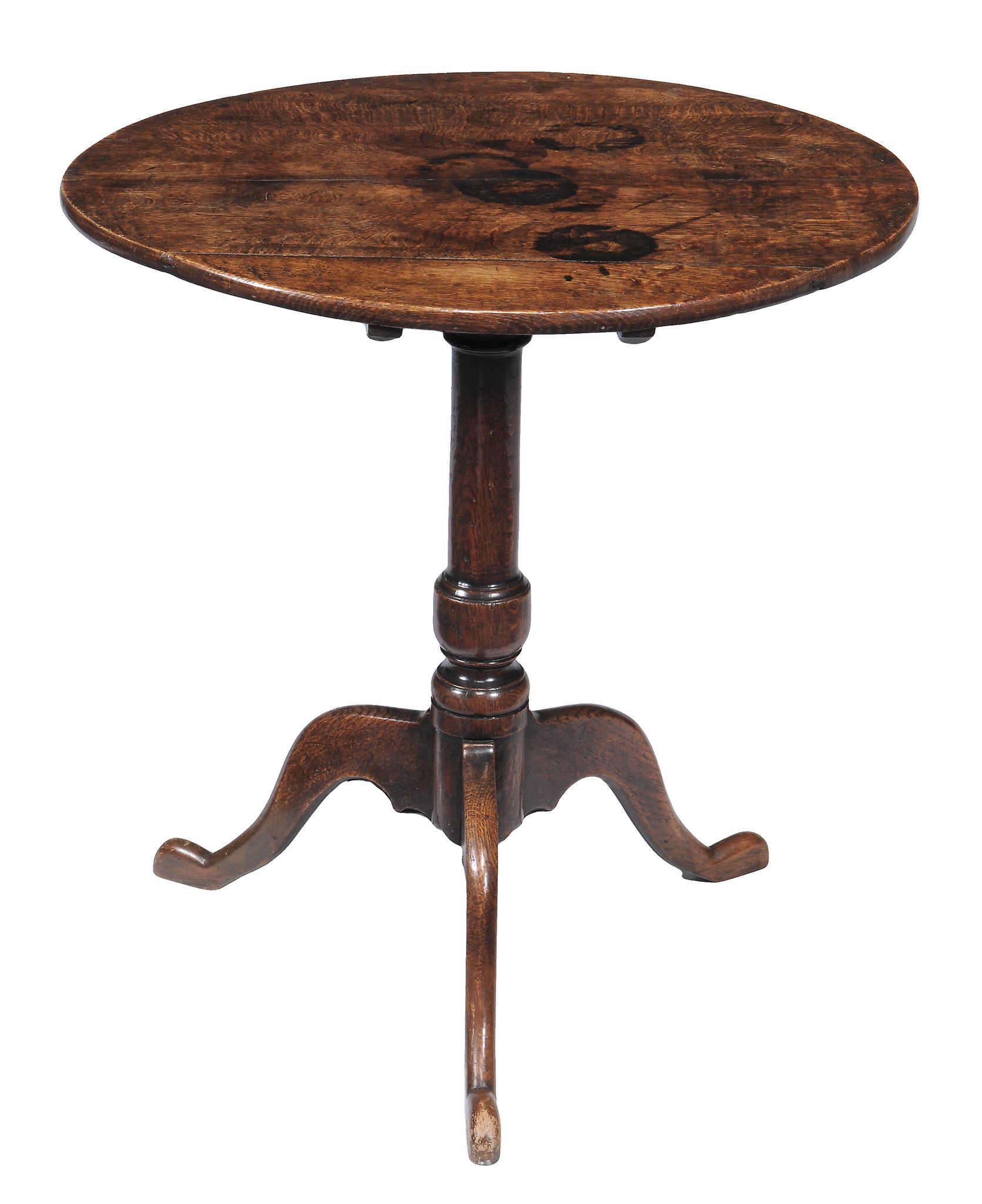 An oak tripod table , early 18th century, the oval tilt top above turned...  An oak tripod