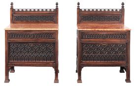 A pair of walnut Gothic revival cabinets, last quarter 19th century  A pair of walnut Gothic revival