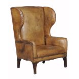 A leather upholstered library chair, in George III style 20th Century  A leather upholstered library