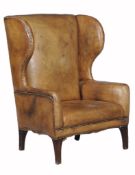A leather upholstered library chair, in George III style 20th Century  A leather upholstered library