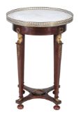 A mahogany and gilt metal mounted circular occasional table in Empire style  A mahogany and gilt