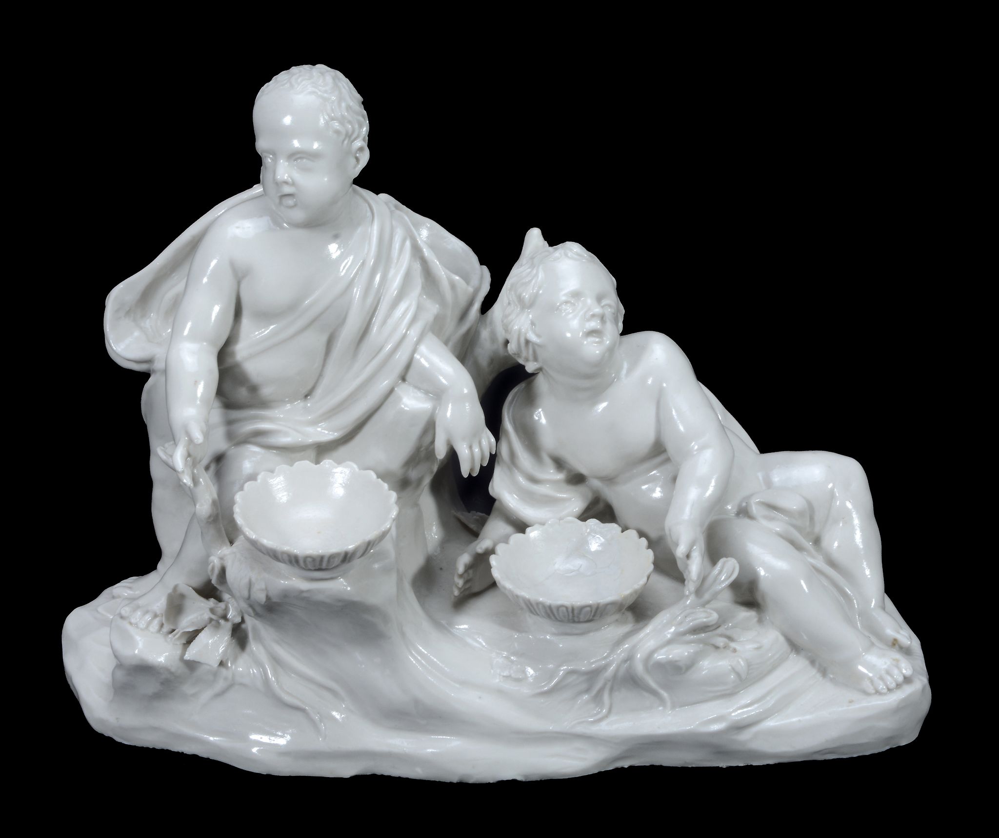 A North Italian porcelain group of two supplicant putti , late 18th century  A North Italian