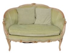 A French Louis XVI style sofa , with carved and curved top rail leading to...  A French Louis XVI
