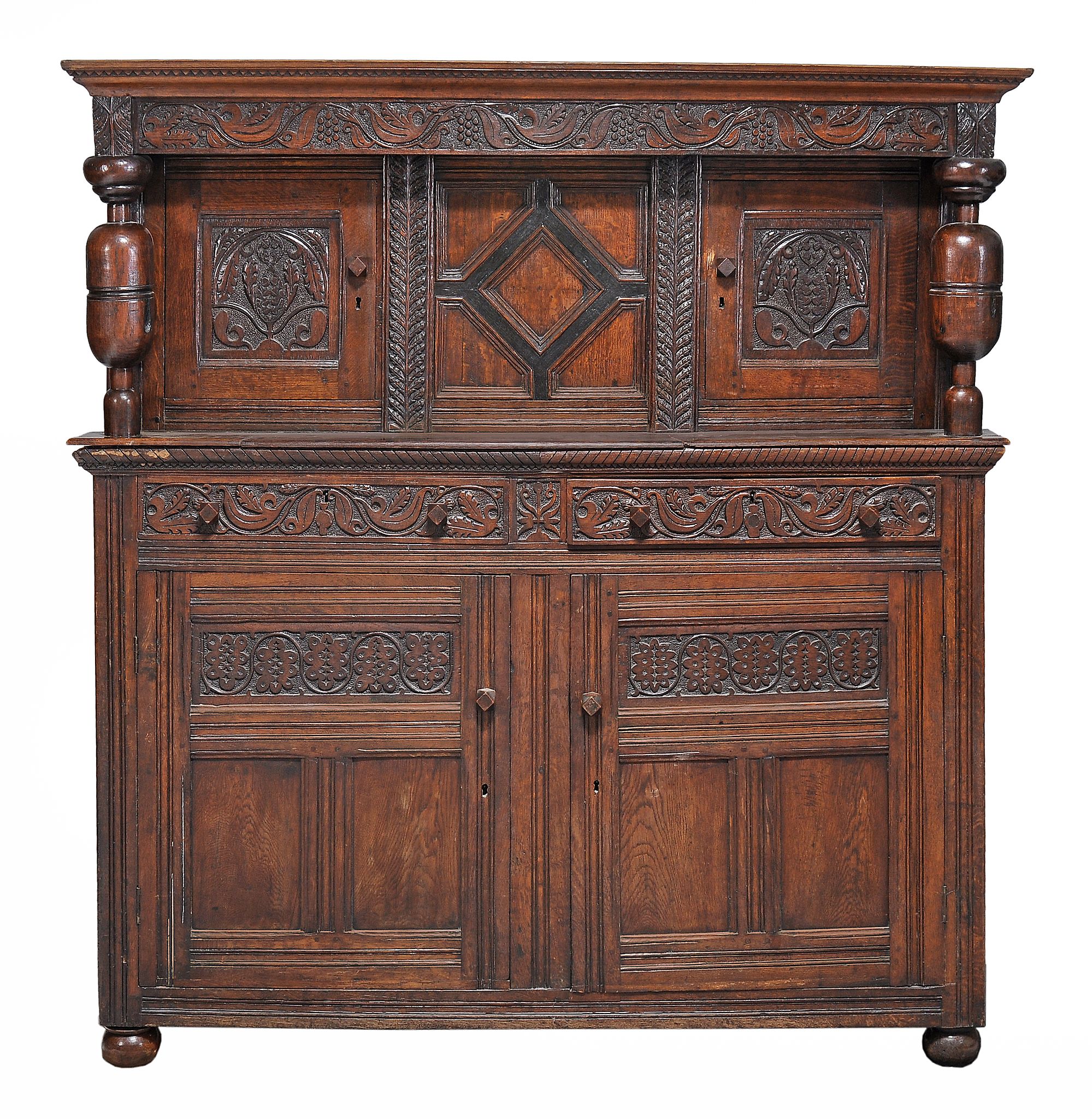 A carved oak court cabinet , 17th century and later  A carved oak court cabinet  , 17th century