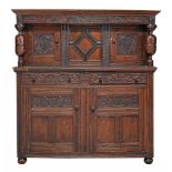A carved oak court cabinet , 17th century and later  A carved oak court cabinet  , 17th century