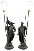 A pair of Continental spelter models of pikemen, later refitted as table lamps  A pair of
