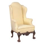 An upholstered and mahogany armchair, in the George III style  An upholstered and mahogany armchair,