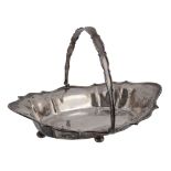 A silver swing handled basket by William Hutton & Sons, Sheffield 1910, with a swing handle, a