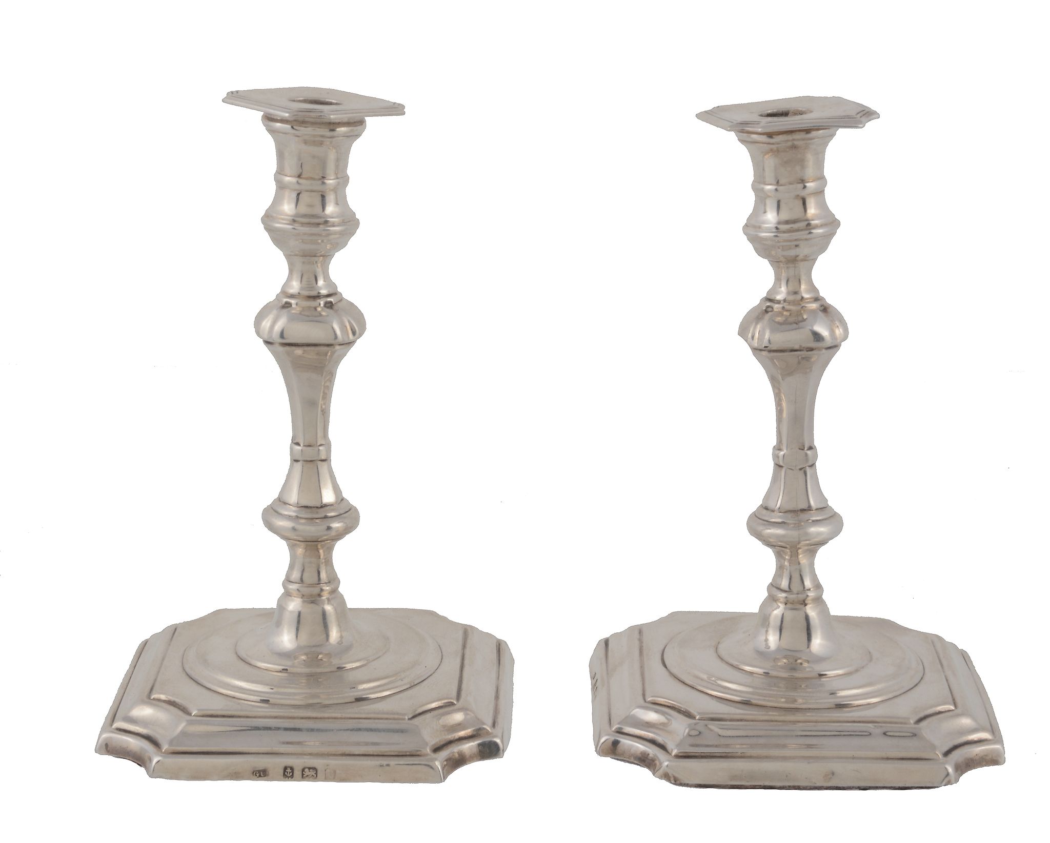 A pair of Edwardian silver tapersticks by George Unite & Sons, Birmingham 1902, in George I style,